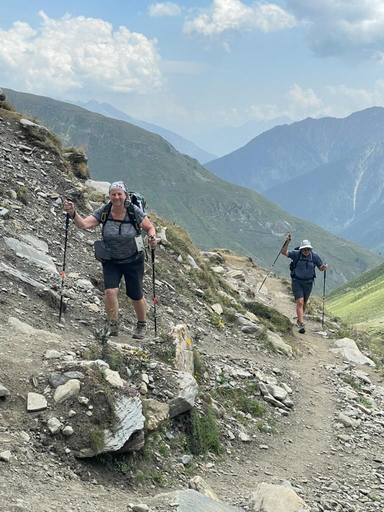 Valley trail with alpine peaks